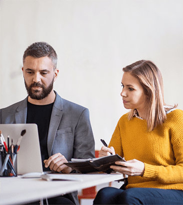 two-business-people-with-wheelchair-in-the-office-PMJT9V5-cropped